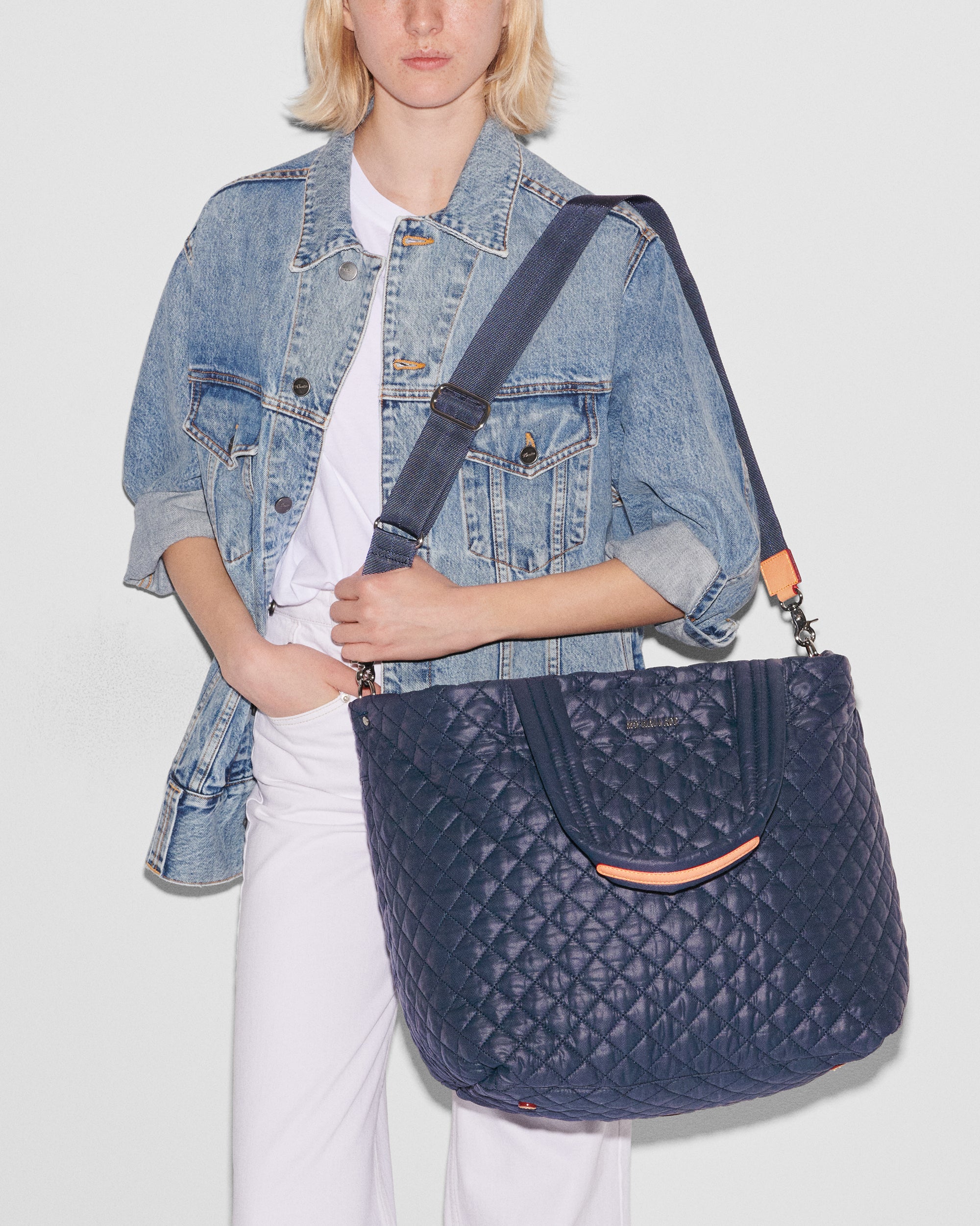 MZ Wallace Large Dark Blue Tote Bag with woman wearing extra strap