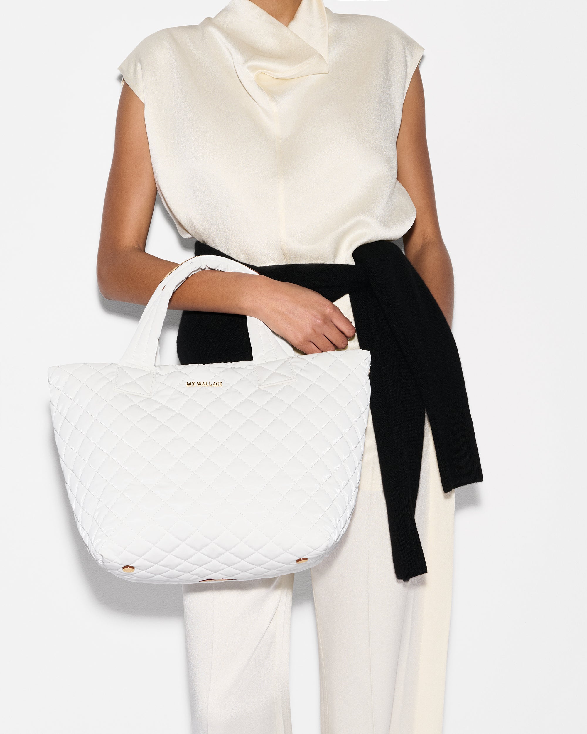 Woman holding MZ Wallace White Tote Bag 