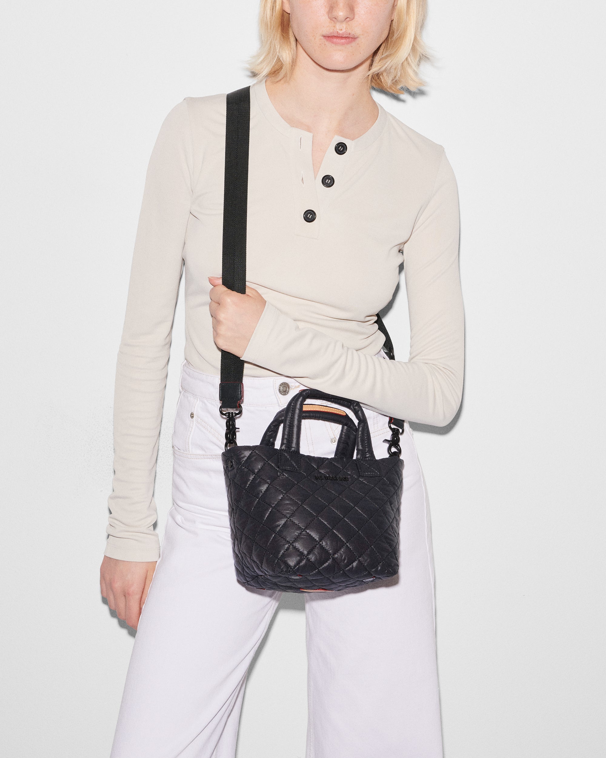 MZ Wallace Black Mini Tote Bag with woman wearing it with strap