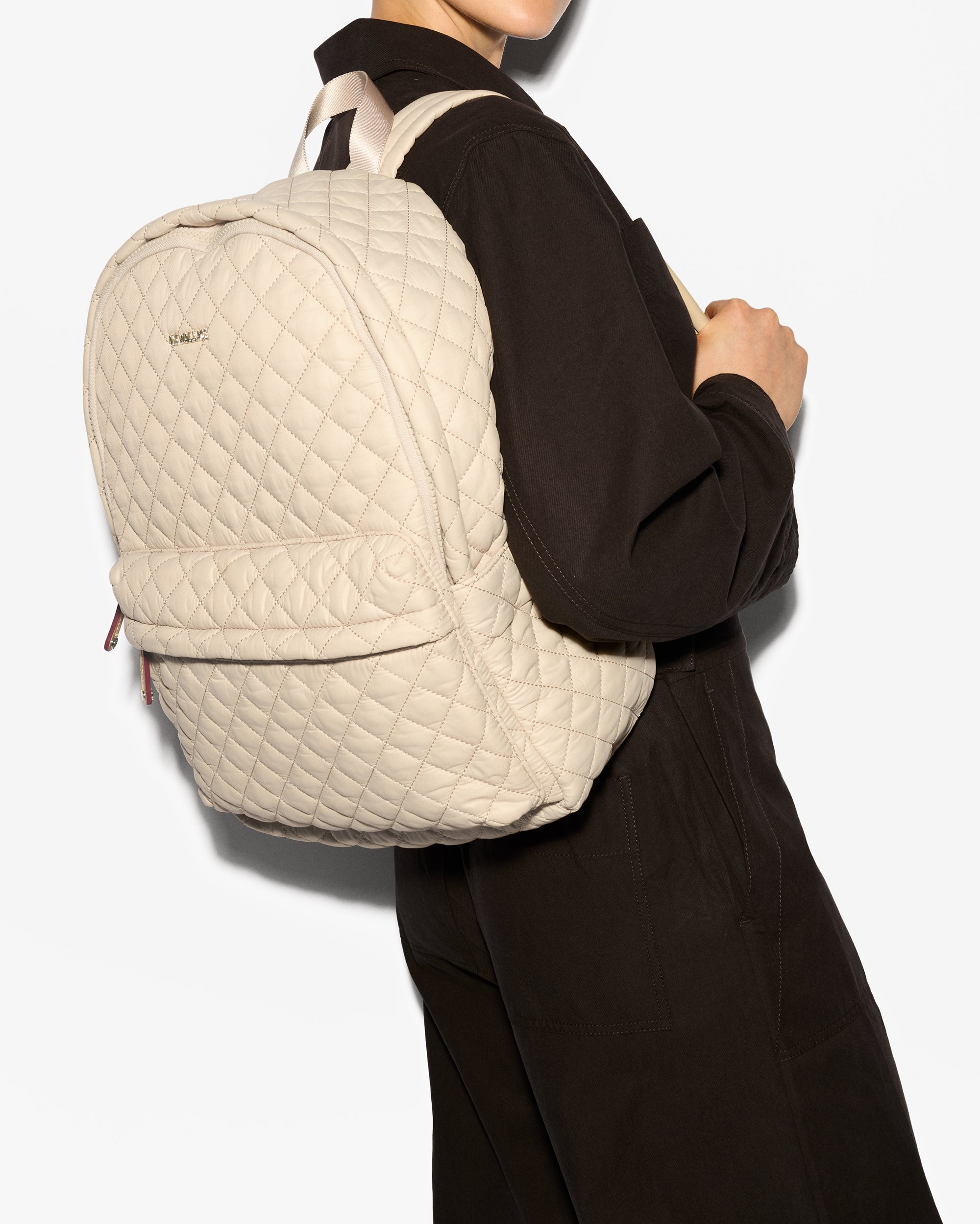 Person wearing MZ Wallace Small Beige Backpack 