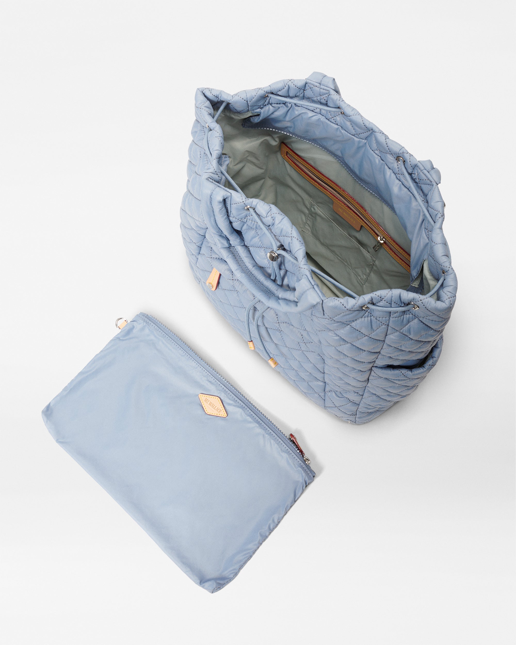 MZ Wallace Light Blue Convertible Backpack Purse open with accessory