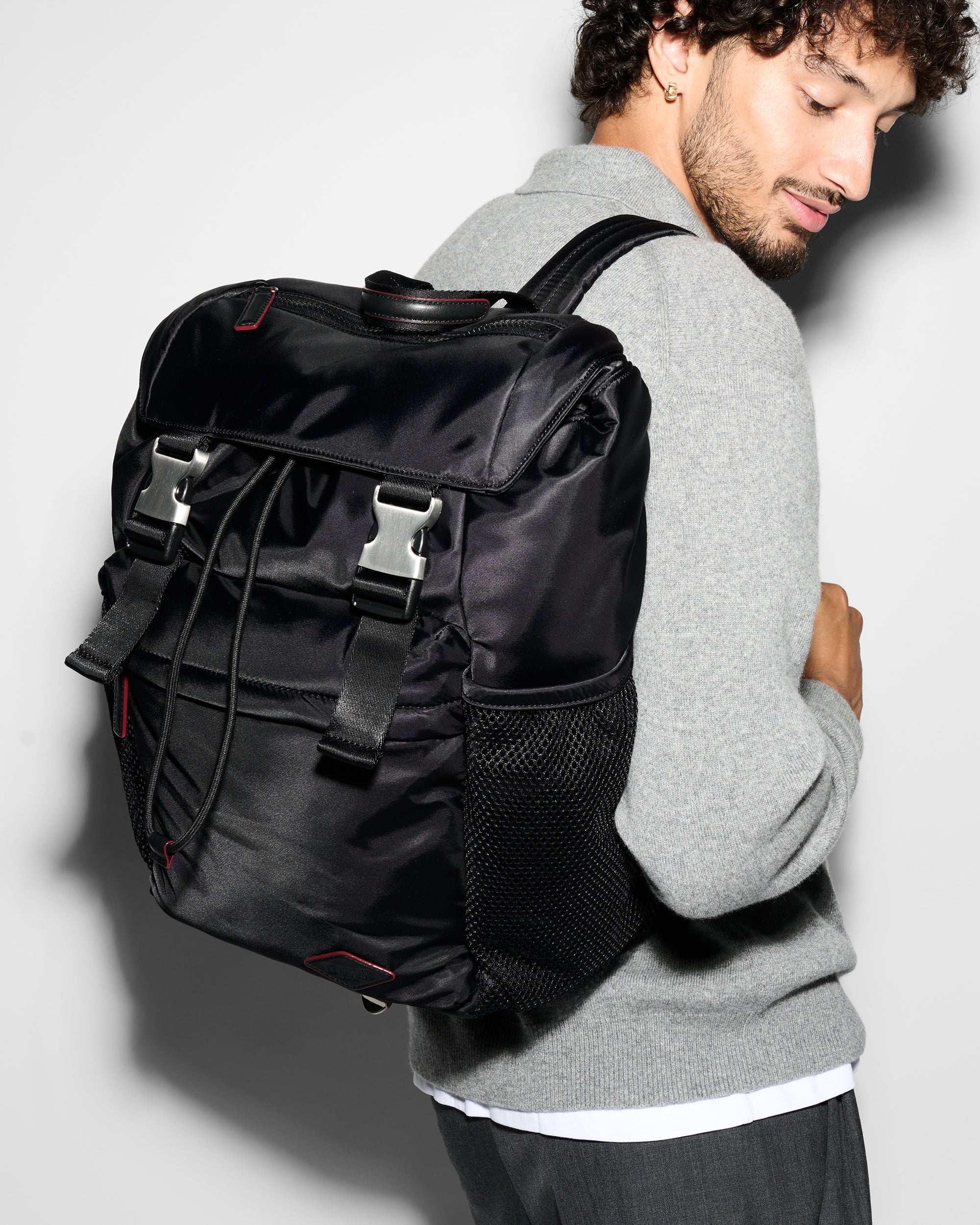 Model with Large Black Rucksack Backpack