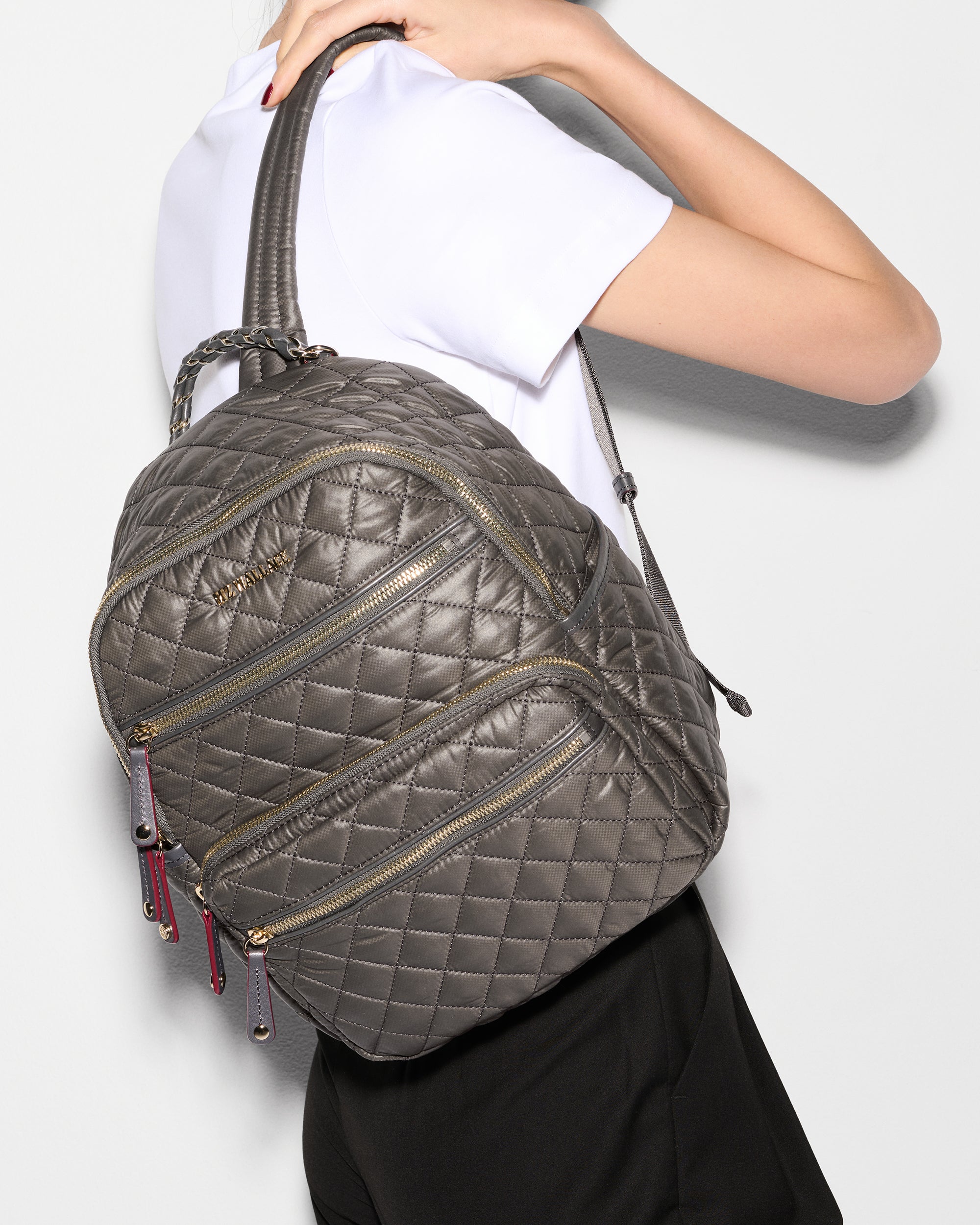 MZ Wallace Small Gray Backpack worn on back