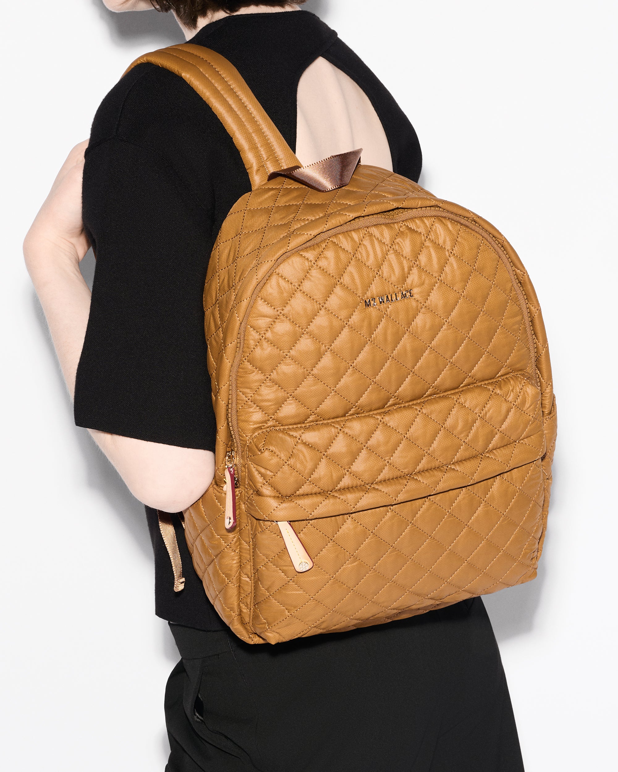 Woman wearing MZ Wallace Amber Backpack  on back