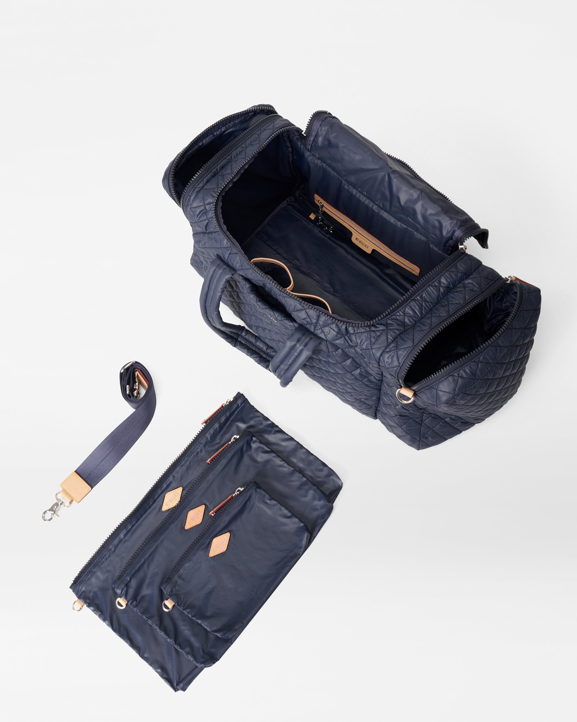 Open MZ Wallace Navy Blue Overnight Bag with accessories
