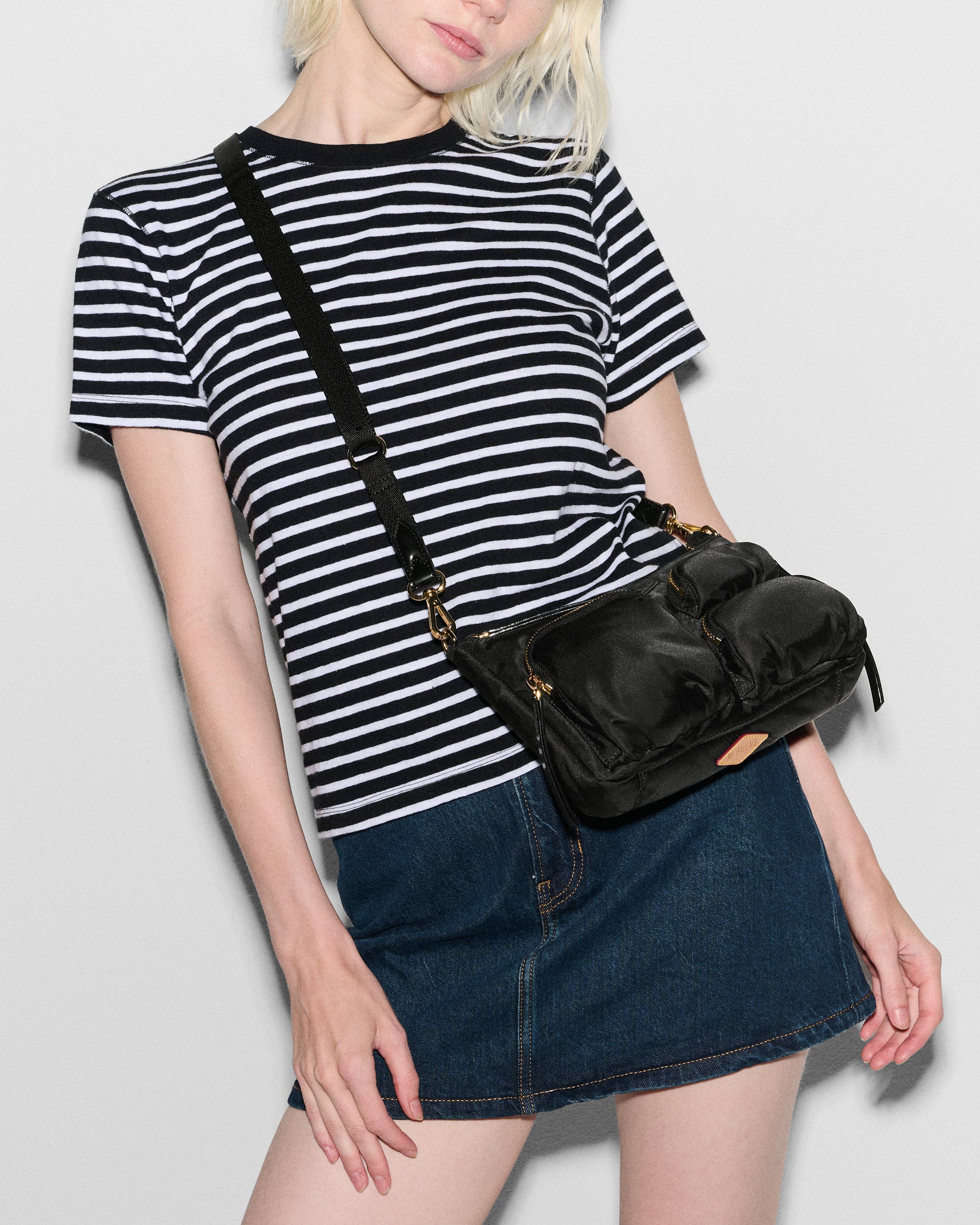 Woman wearing MZ Wallace Small Black Shoulder Bag as crossbody bag