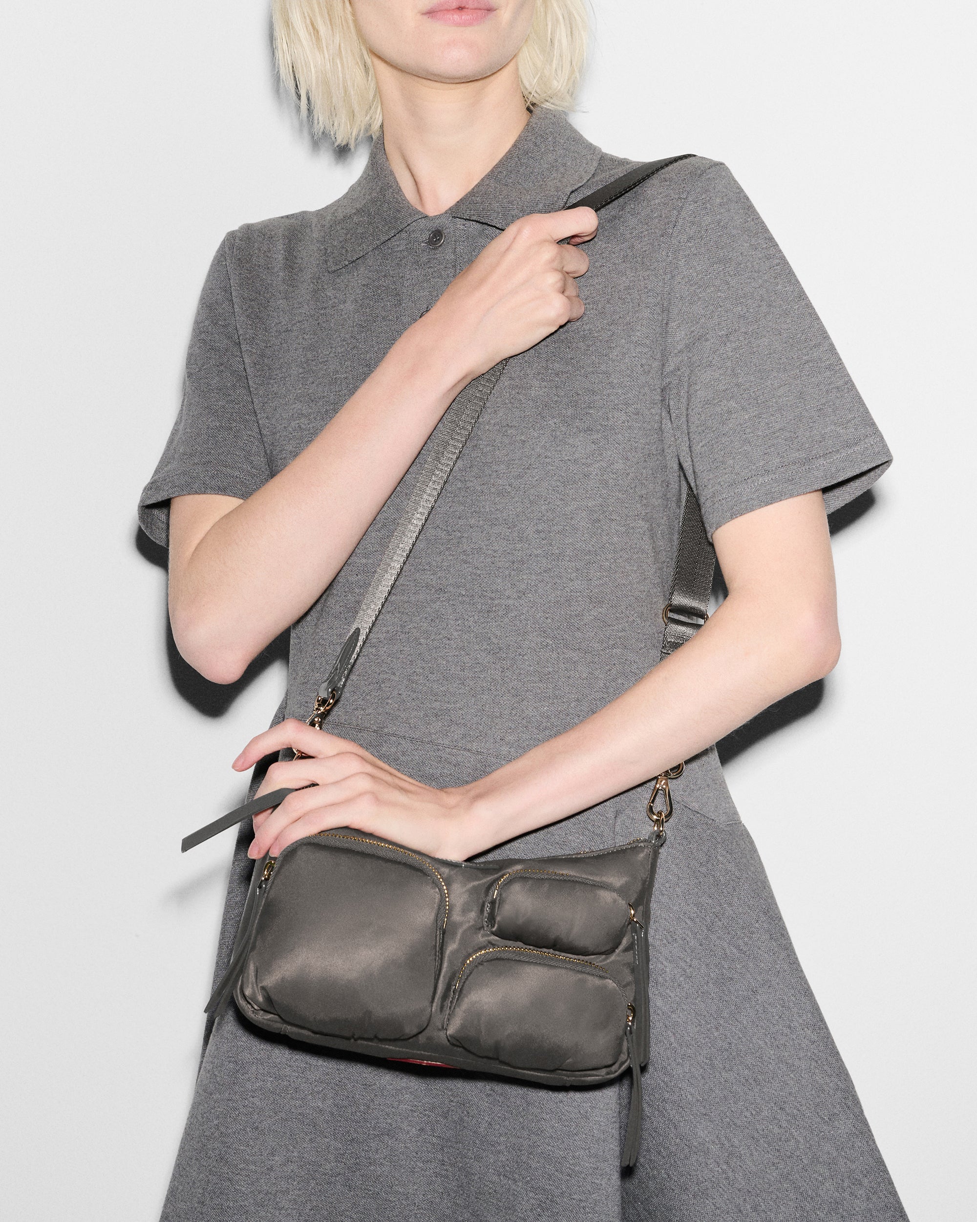 Person wearing MZ Wallace Grey Shoulder Bag on shoulder
