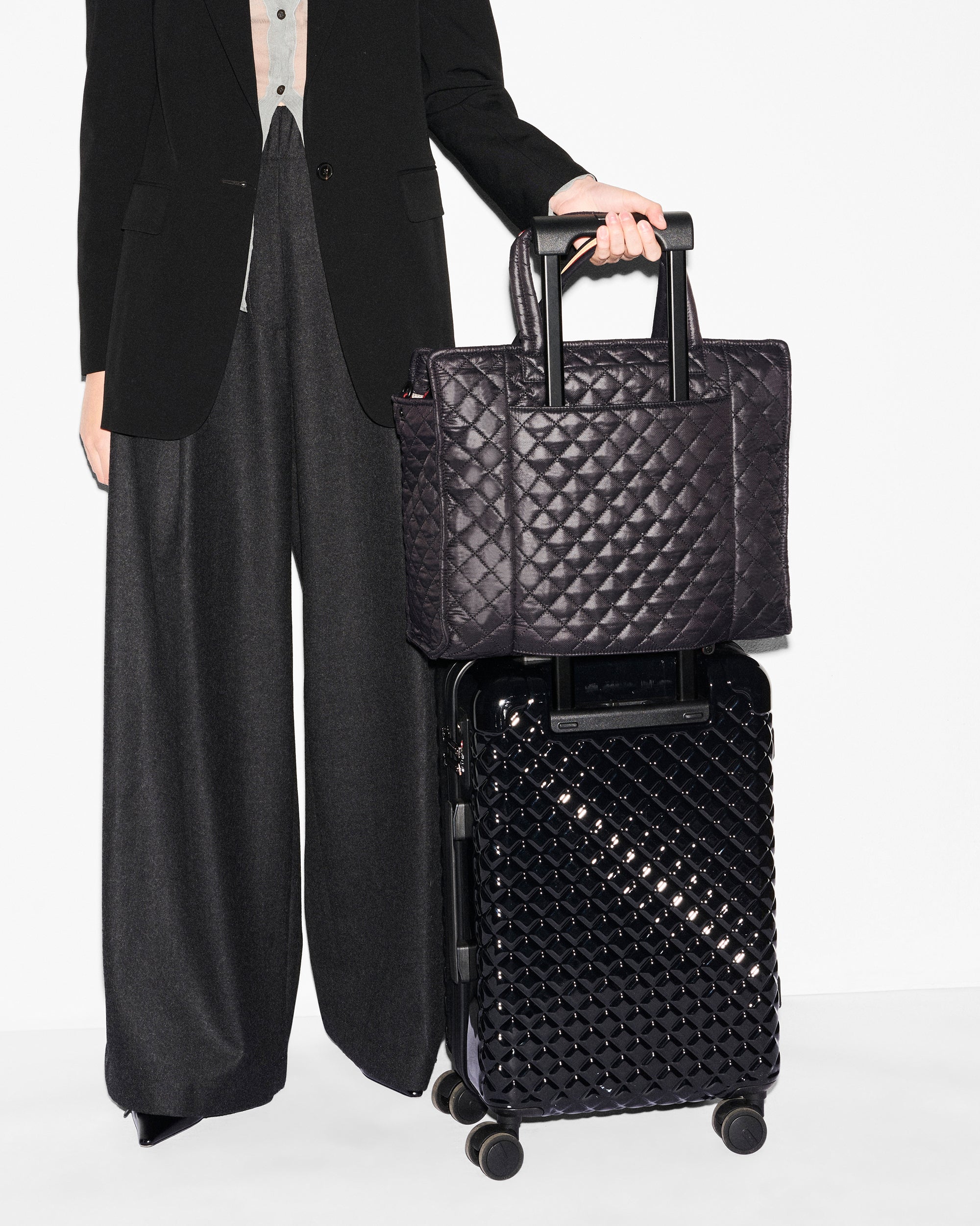 MZ Wallace Large Black Structured Tote Bag on luggage