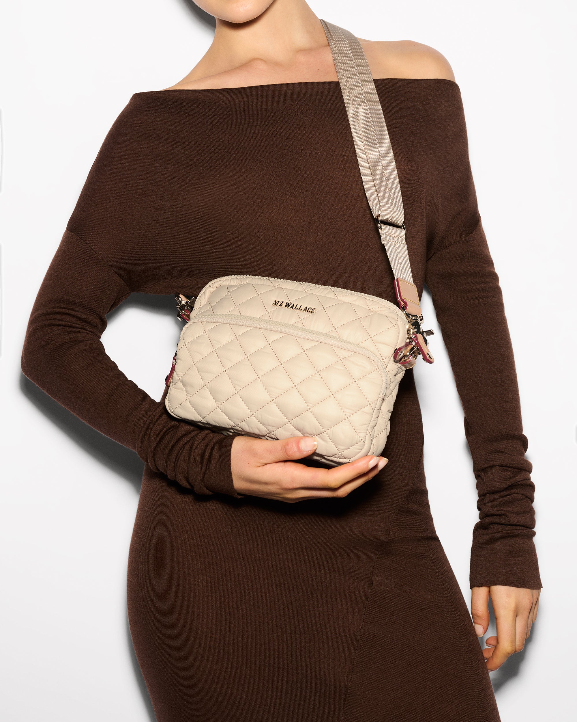 Woman showcasing MZ Wallace Buff Camera Ivory Crossbody Bag