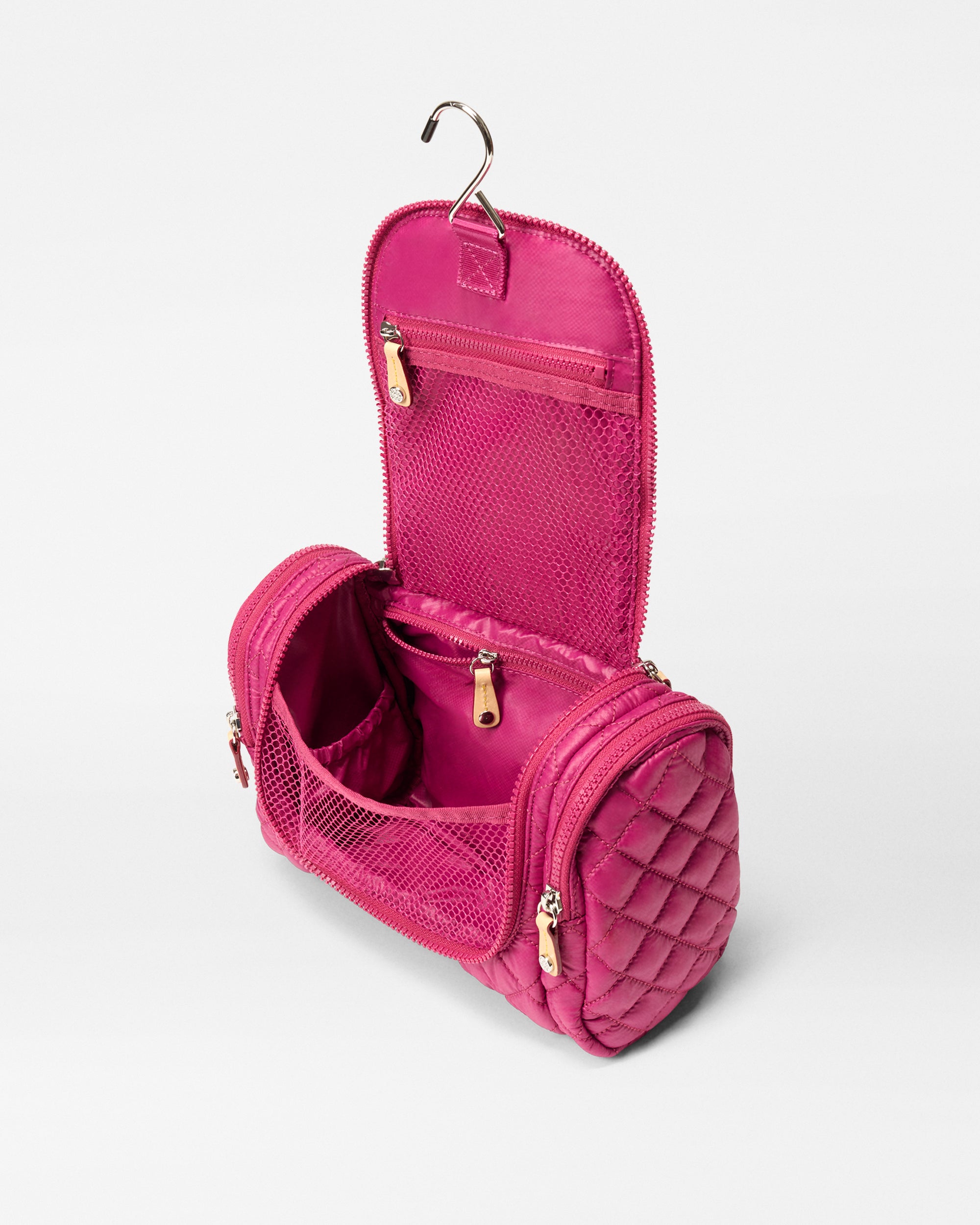 MZ Wallace Pink Travel Toiletry Bag opened with hanger on top and mesh compartments 