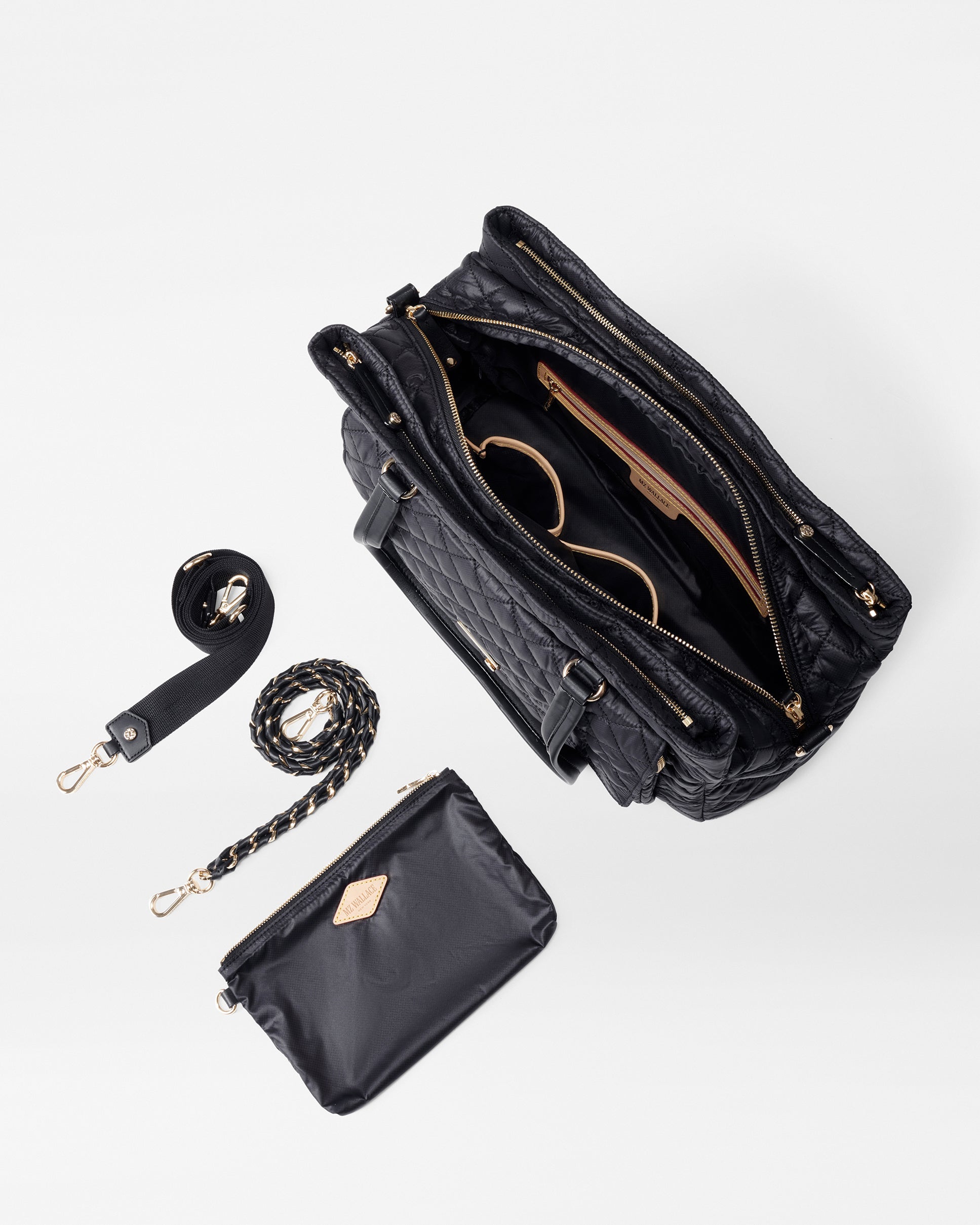 Top view of open MZ Wallace Black Structured Work Bag and included accessories