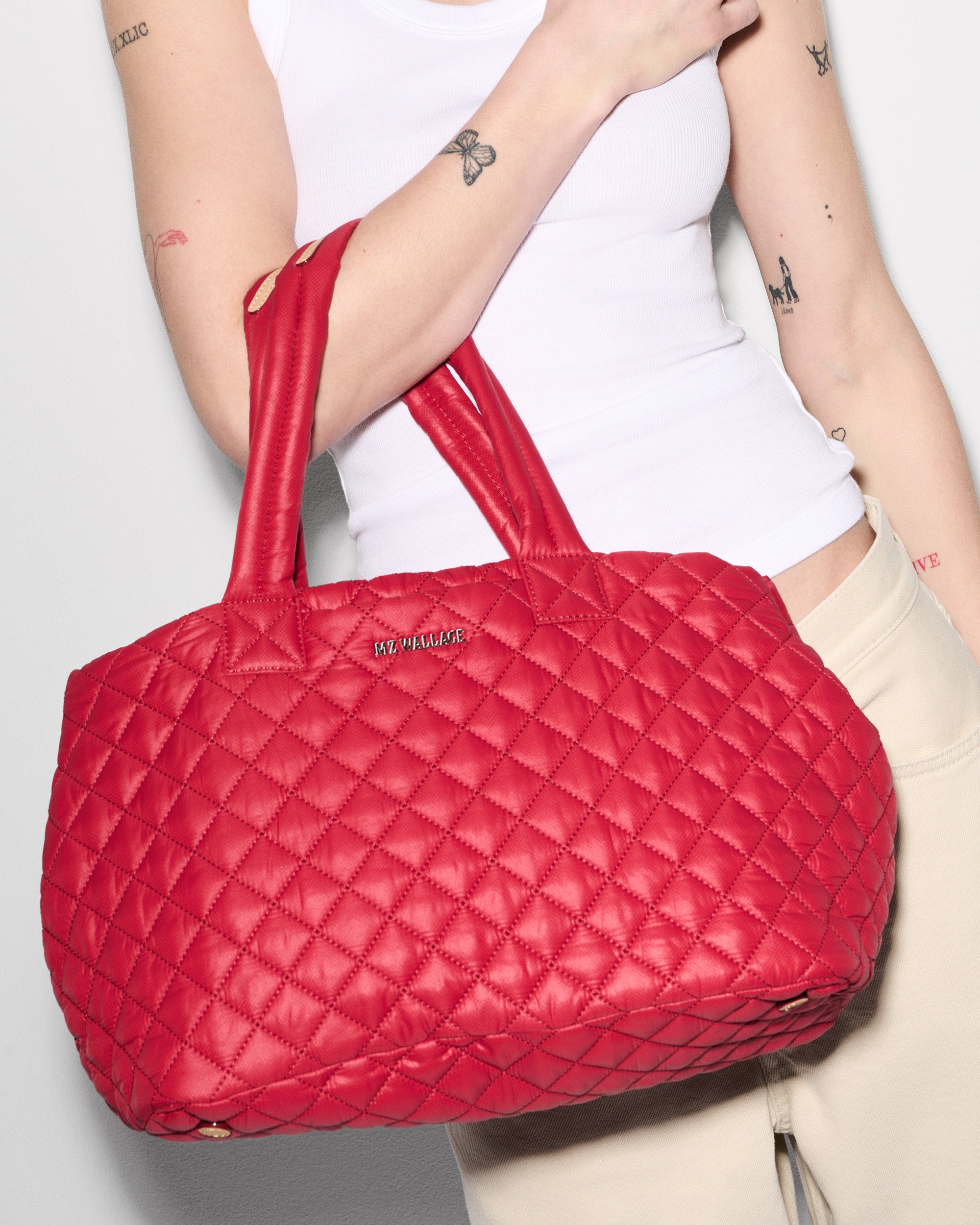 MZ Wallace Red Work Bag on woman's arm