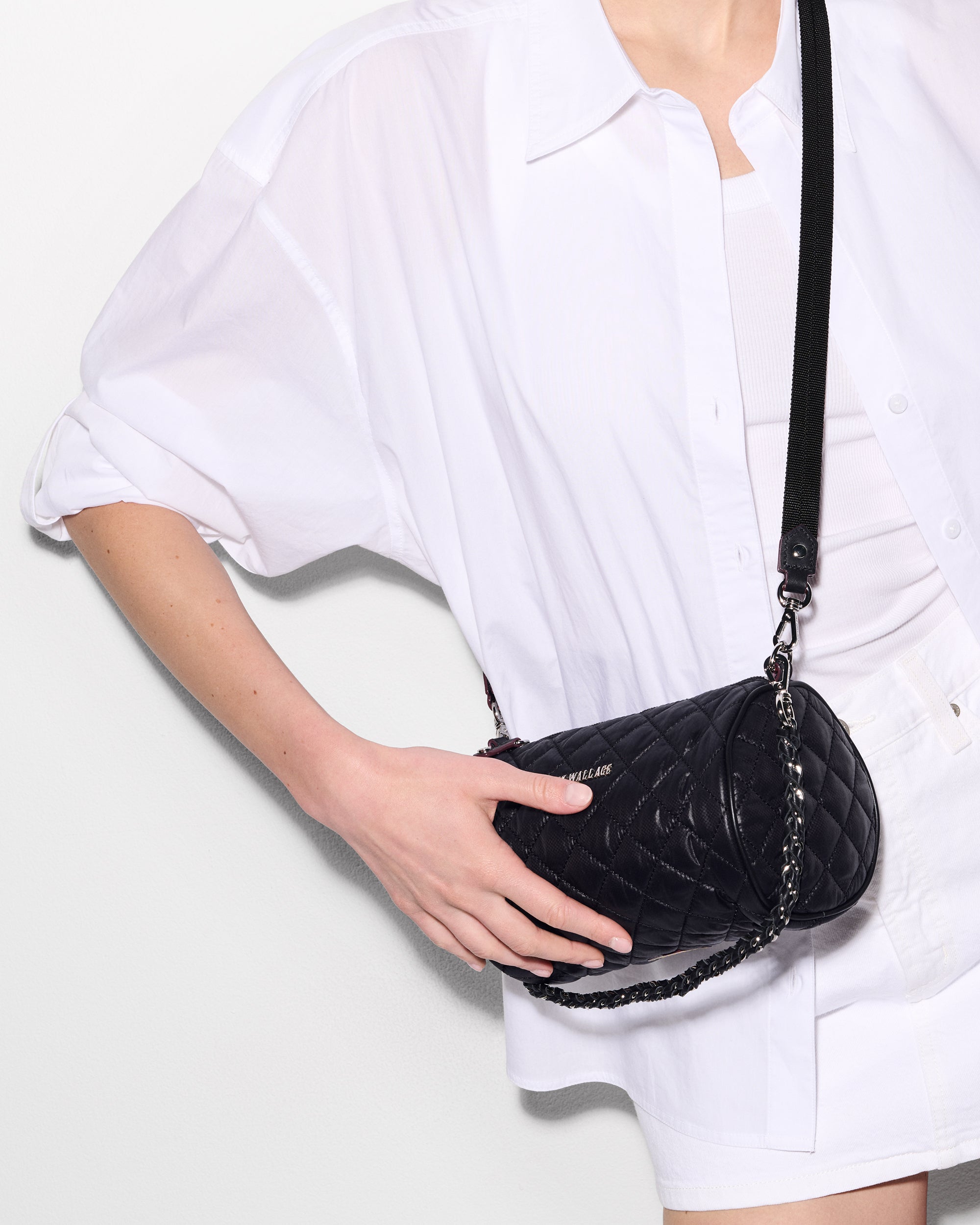 Model with Black Crossbody Barrel Bag and Attachable Strap