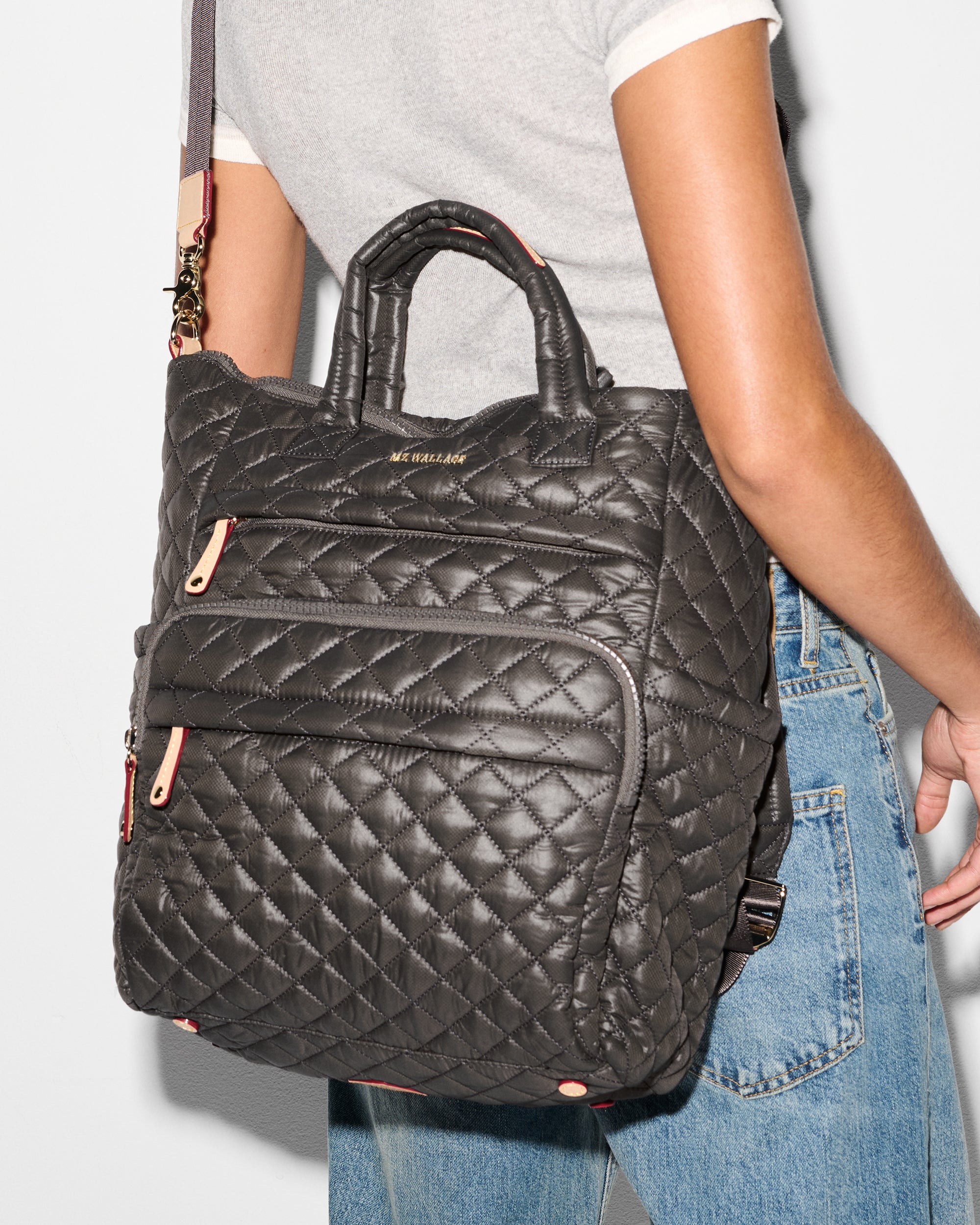 MZ Wallace Grey Backpack Purse worn as crossbody