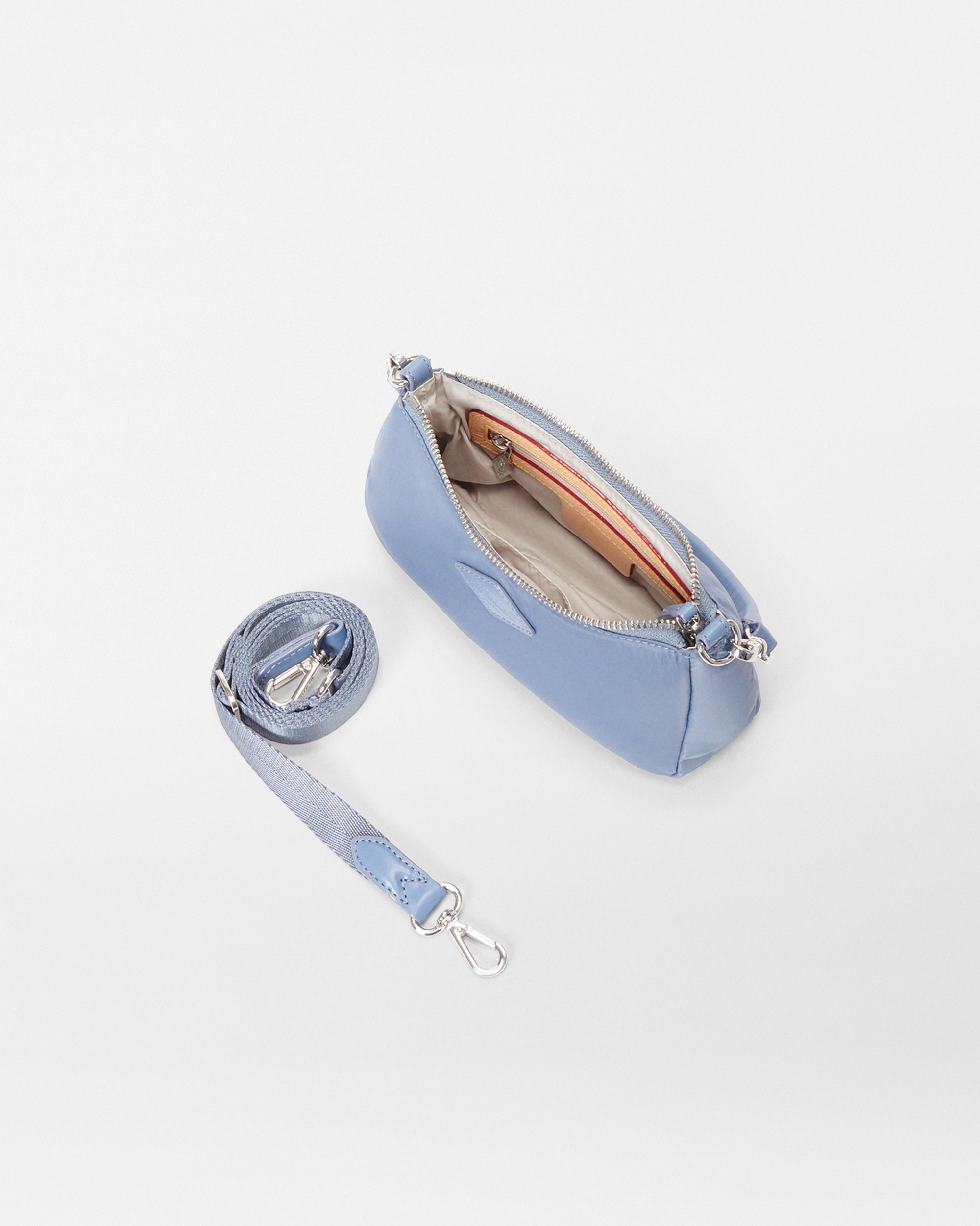 Inside view of MZ Wallace Mini Blue Purse with crossbody strap