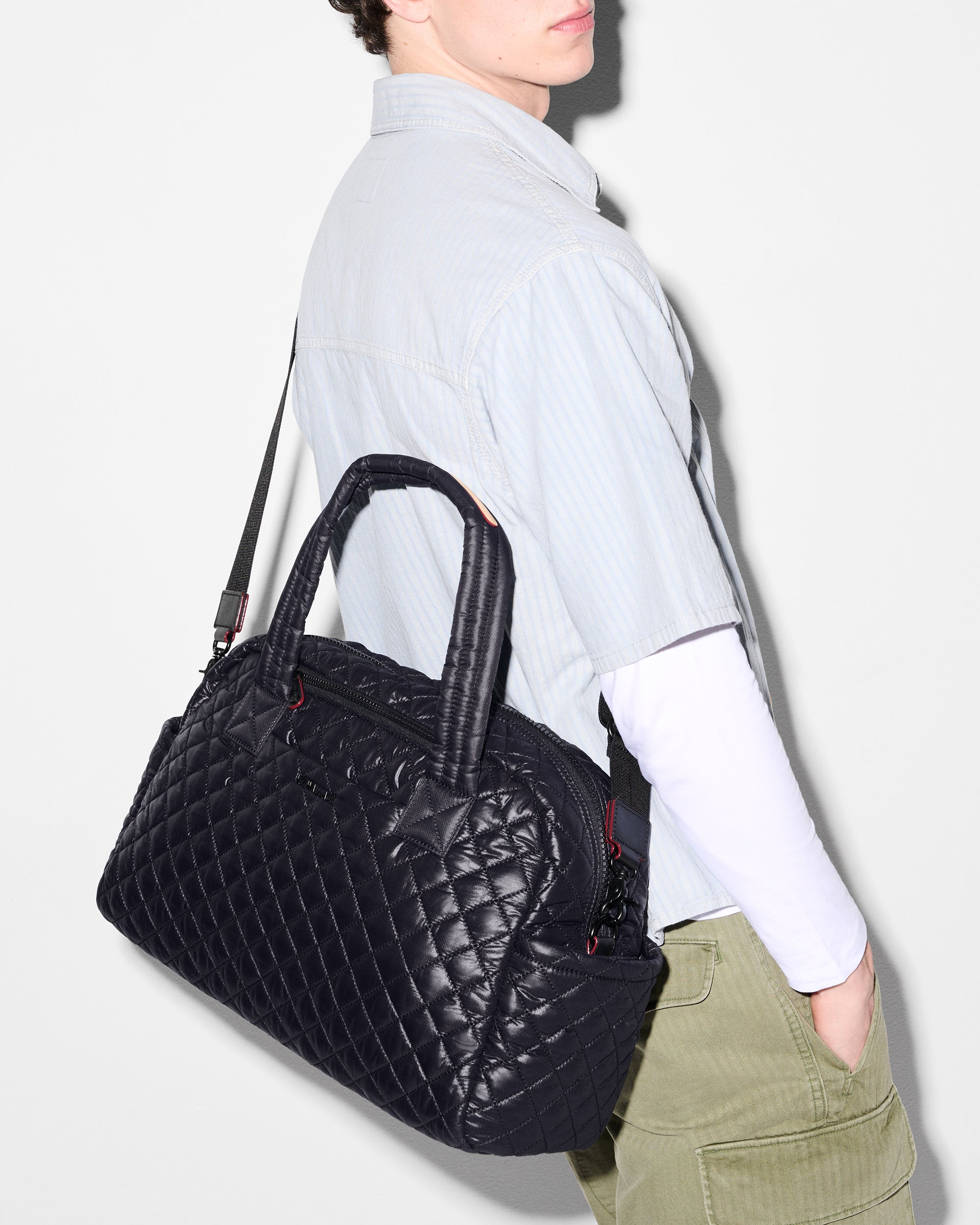 MZ Wallace Black Travel Duffle Bag worn as crossbody