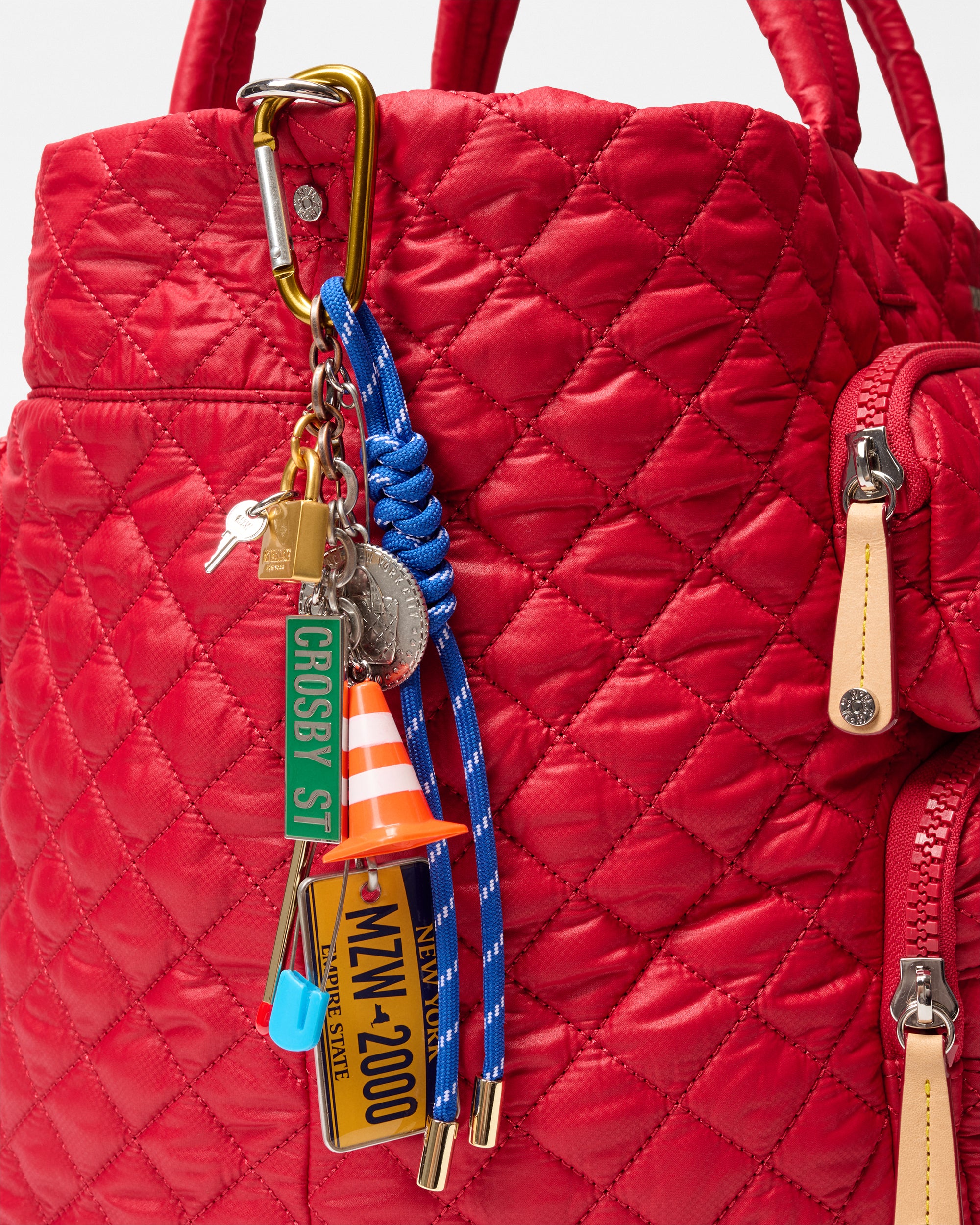 MZ Wallace Apple Bag Charm on red bag