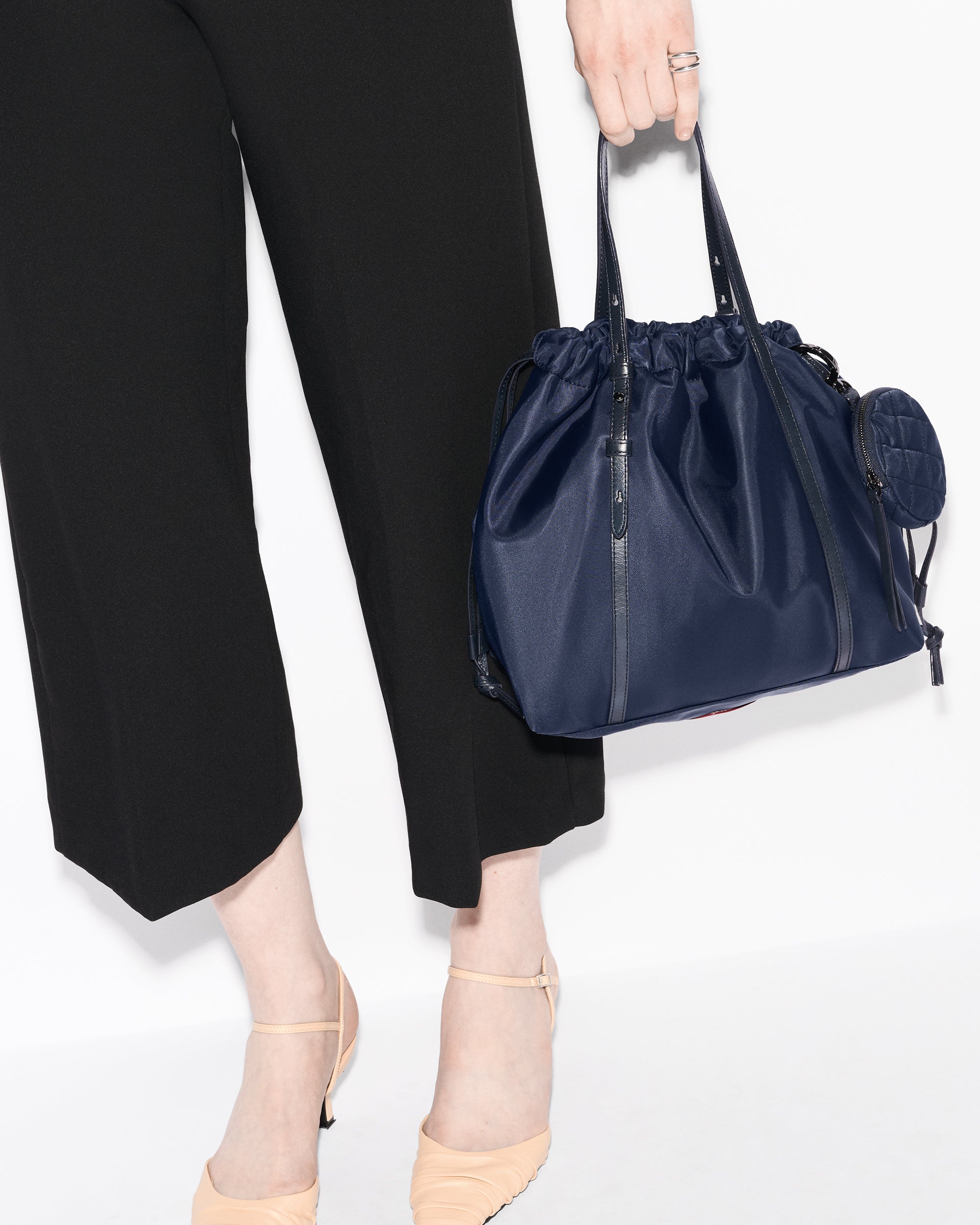 MZ Wallace Small Navy Tote Bag worn in hand 