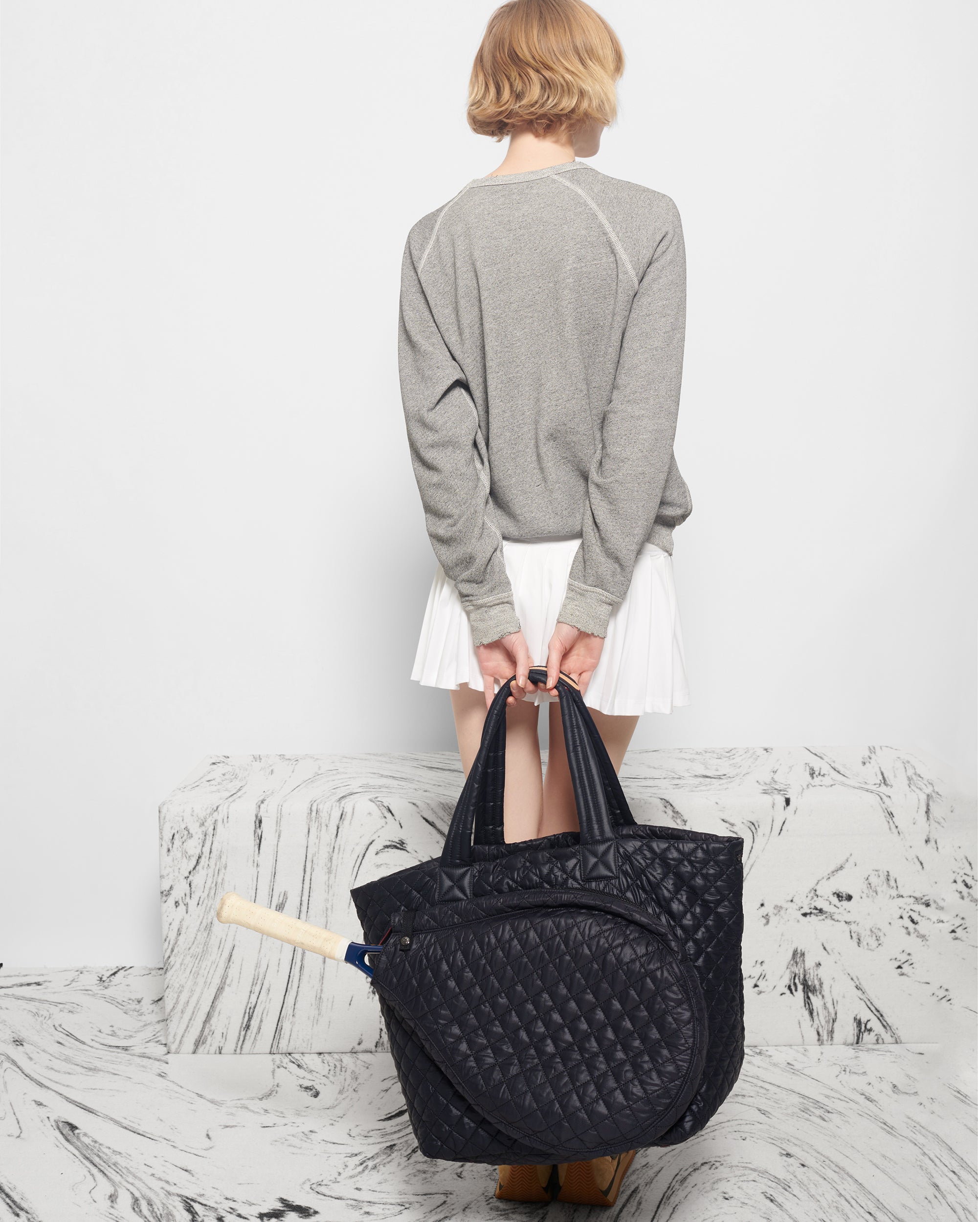 MZ Wallace Quilted Large Black Tennis Bag  behind