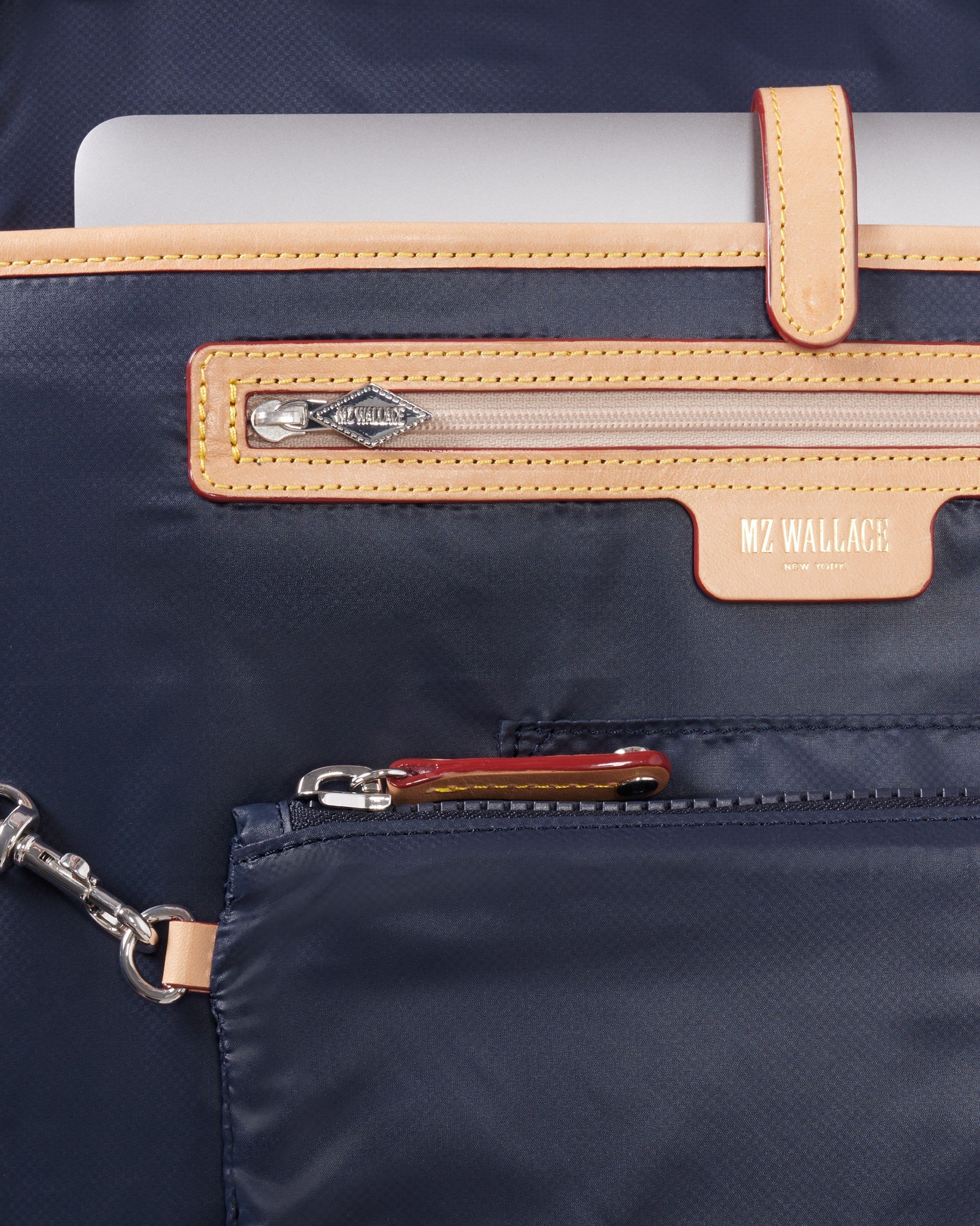 MZ Wallace Dawn Nik Blue Duffel Bag close up of interior zippers