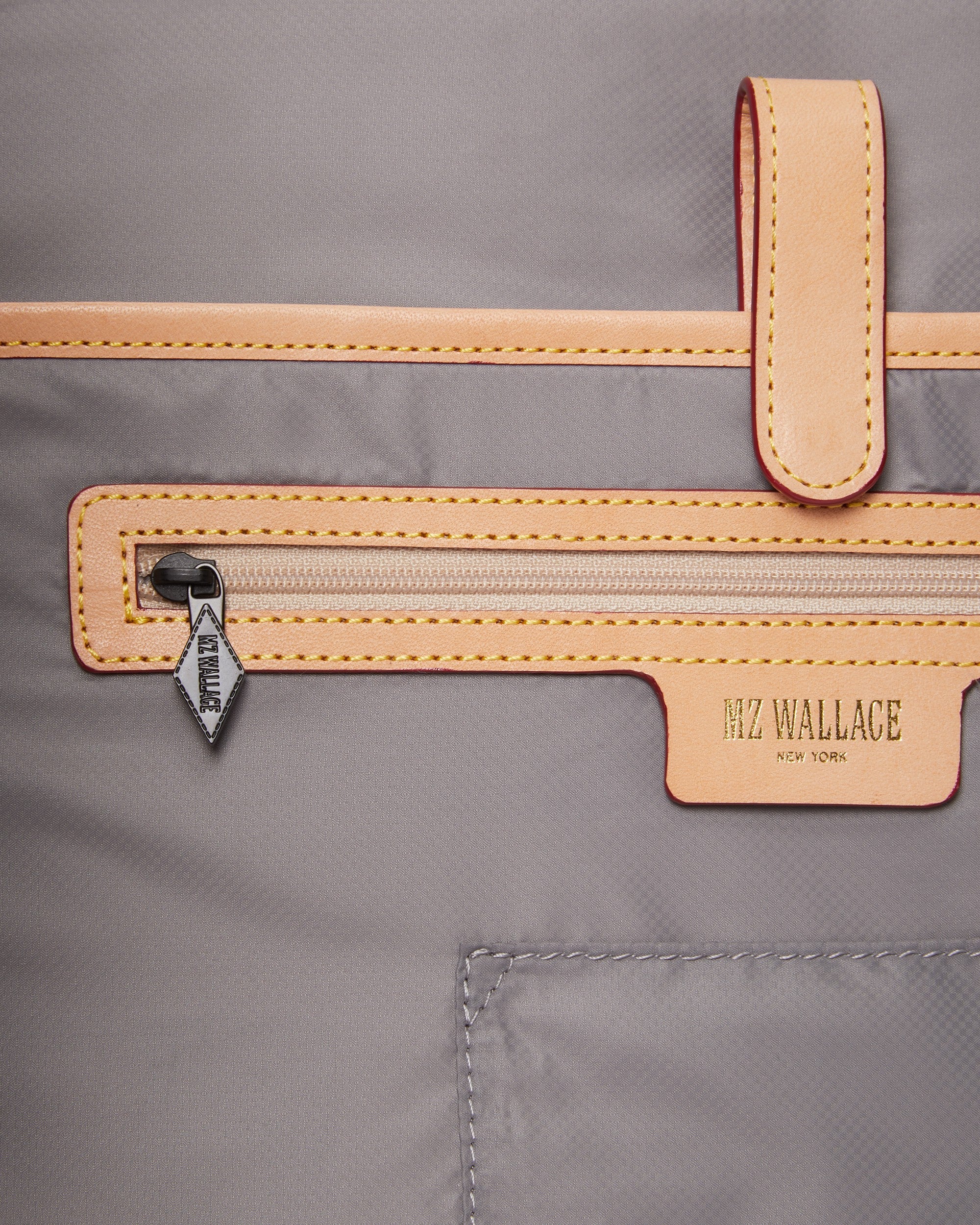 Close up of MZ Wallace Black Laptop Bag interior zipper