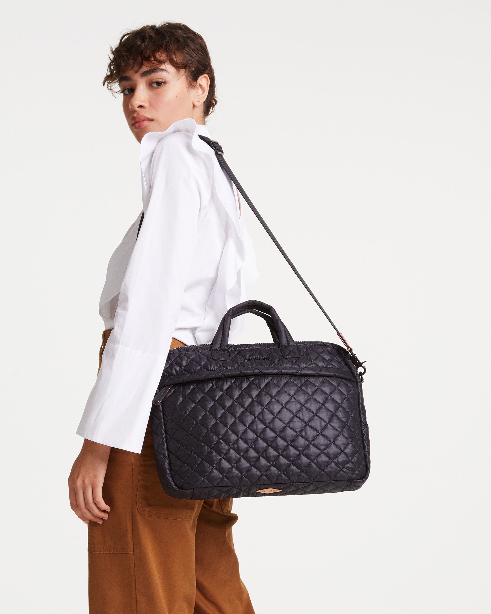 Woman wearing MZ Wallace Black Laptop Bag on shoulder